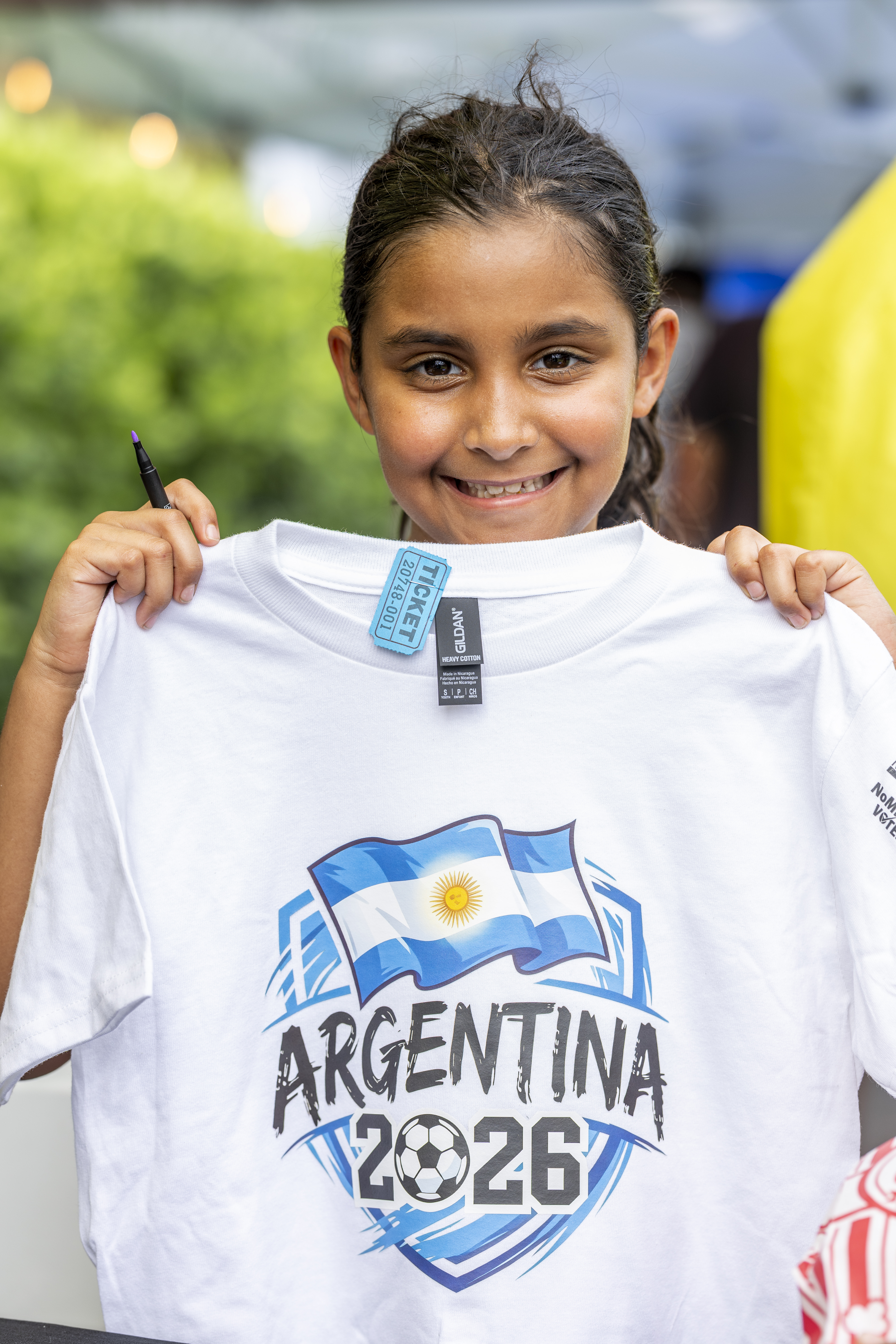 Girl holding Argentina shirt